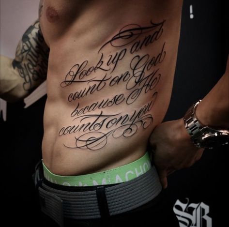 Side Stomach Tattoos For Guys, Mens Rib Tattoo, Chest Tattoo Lettering, Side Body Tattoos, Rib Tattoo Quotes, Lower Stomach Tattoos, Rib Tattoos For Guys, Tattoo Lettering Styles, Torso Tattoos