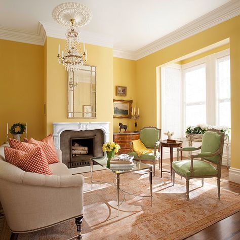 Bathed in light from the bay window, buttery yellow walls keep the large space from becoming too formal while putting the focus on the confection of period details. Yellow Living Room Colors, Yellow Walls Living Room, Yellow Decor Living Room, Furnitur Ruang Keluarga, Yellow Room, Yellow Living Room, Living Room Color Schemes, Yellow Decor, Yellow Interior