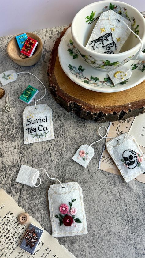 Alyssa Stokes | Embroidered Felt Tea Bags 🫖 Spill the tea! I created these embroidered felt tea bags inspired by the Suriel in A Court of Thorns and... | Instagram Diy Gift For Traveler, Felt Tea Bag Bookmark, Diy Tea Wallet, Teabag Bookmark, Homemade Tea Bags, Tea Bag Bookmark, Felt Tea Bags, Tea Bag Tags, The Suriel