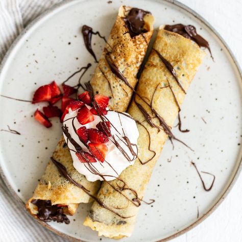 Two crepes on a plate with nutella, strawberries, and whipped cream on top French Crepe Recipe, Blueberry French Toast Casserole, Homemade Crepes, Sweet Crepes, Handle The Heat, How To Make Crepe, French Crepes, Savory Crepes, Chocolate Lava Cake