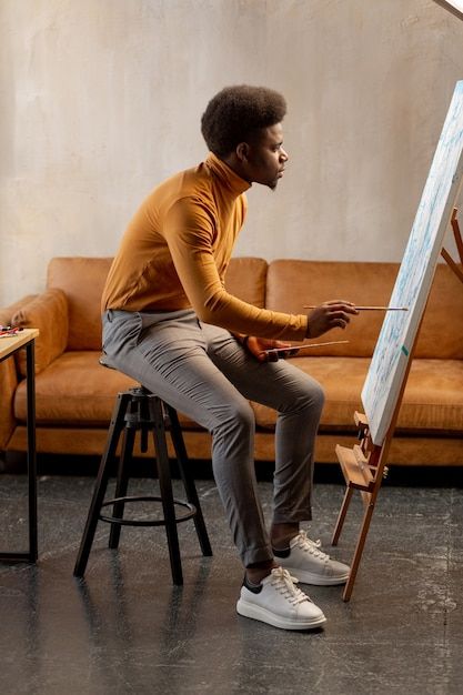 Talented young man looking at the canvas... | Premium Photo #Freepik #photo #man-painting #artist-painting #artist #canvas-painting Jungle Portrait, A Man Painting, 20s Men, Fragile Masculinity, Man Painting, Feeling Low, Thinking Man, Art Lifestyle, Men Photoshoot