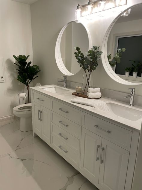 Bathroom Decor With White Cabinets, Guest Bathroom Silver Hardware, Gray Silver Bathroom Ideas, White Bathroom Silver Hardware, Bathroom Decor With Silver Fixtures, Double Vanity Countertop Decor, White Bathroom Vanity Black Countertop, White Bathroom Cabinets Silver Hardware, Silver Accent Bathroom