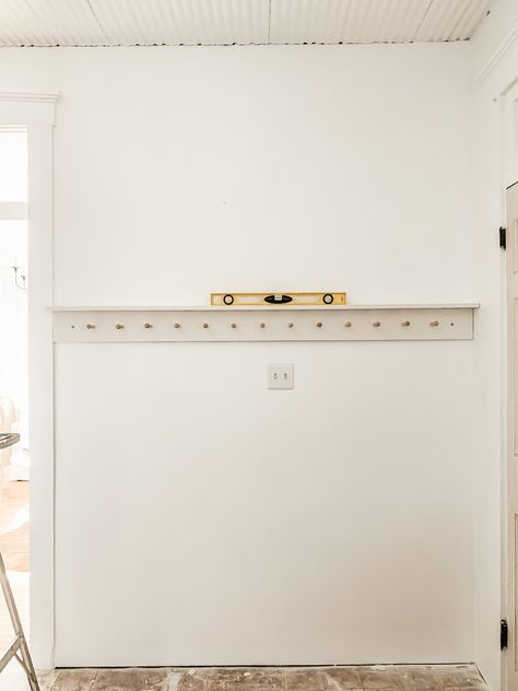 DIY Peg Rail for Function and Style - Midcounty Journal Armoire In Front Of Window, Peg Rail In Bedroom, Entry Way Peg Rack, Hallway Peg Rail, Mudroom With Peg Rail, Double Row Hooks Mudroom, Peg Wall Bathroom, Peg Rail Shelf Diy, Entry Peg Rail