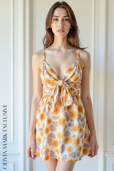 Its sunflower motif, painted in a warm palette of yellows and browns against a pristine white canvas, dances with the essence of summer. The plunging neckline and tie-front design add a daring yet feminine flair, while the flowing skirt flares gracefully, creating a silhouette that is both playful and sophisticated. Wear it to garden parties, under the stars, or simply as a burst of color in your everyday wardrobe—it's a piece that radiates joy and celebrates the beauty of nature. Sunflower Motif, Warm Palette, Lounge Dress, Garden Parties, Flowing Skirt, Under The Stars, Brown Floral, White Canvas, Yellow And Brown