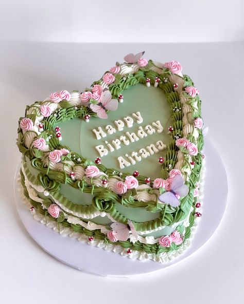 Rosettes on vines, butterflies, and tiny mushrooms for this cottage-core cake! 🍄 Cake Deets: 🤎 8” Chocolate Cake 🍓 Strawberry Jelly Filling 🧁 Vanilla Swiss Meringue Buttercream @colour.mill colors used: 🌿 Sage 🍋‍🟩 Lime 🌸 Rose #killerbakeryla #killertreats #lambethcake #vintagecake #vintagecakes #minicakes #heartcakes #vintageheartcake #romance #vintagebirthdaycake Cottage Core Cake, Chocolate Cake Strawberry, Vintage Birthday Cakes, Cake Strawberry, Tiny Mushroom, Heart Cakes, Strawberry Jelly, Meringue Buttercream, Life Crisis