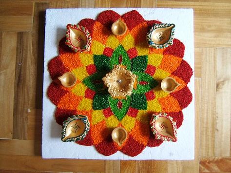 Rice Kolam Designs, Rice Rangoli Design, Rangoli Designs With Rice, Rice Rangoli, Artistic Rangoli, Rangoli Decoration, Coloured Rice, Poo Kolam, Aarti Thali