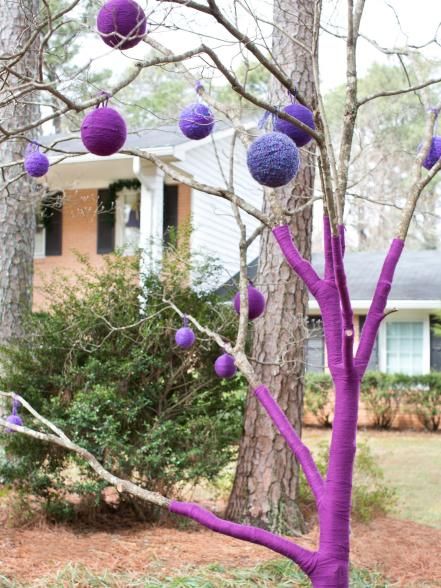 Ornaments are optional, but we love the way they look on a bare-boned tree in various sizes. Tree Branch Crafts, Forest Ideas, Spirit Sticks, Yard Art Crafts, Yarn Trees, Crochet Tree, Pom Garland, Bare Tree, Pom Pom Garland