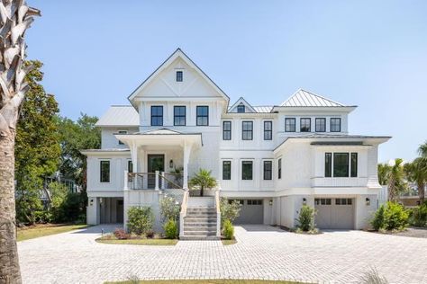 The exterior of this large coastal home features many windows, gorgeous light woods, and greenery. Spanish Inspired Home, Beach House Pictures, Beautiful Beach Houses, Farmhouse Architecture, Home Design Magazines, Hgtv Dream Home, Beachfront Home, Charleston Homes, Isle Of Palms