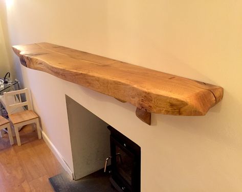 Mantle Shelf crafted from our own stock of sustainably harvested English Oak with a beautiful natural edge. Oak Mantle Fireplace, Natural Wood Mantle, Live Edge Cedar Mantle, Railway Sleeper Mantlepiece, Walnut Live Edge Mantle, Oak Mantle Shelf, Live Edge Mantle, Live Edge Fireplace Mantel Oak, Mantle Shelves