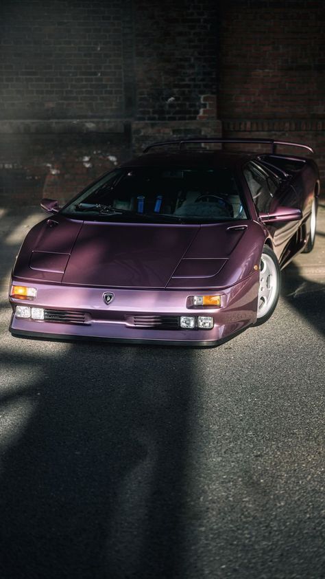 It’s one of just 150 SE30 Diablos built. And it’s purple. The SE30 was a celebration of Lamborghini’s 30th anniversary, 5.7-litre V12-engine with around 523bhp, 0-62mph in around four seconds and a top speed of over 200mph Lambo Diablo, Vw Minibus, Truck Wallpaper, Sports Car Wallpaper, Purple Car, Vintage Sports Cars, V12 Engine, Nissan 240sx, Car Memes