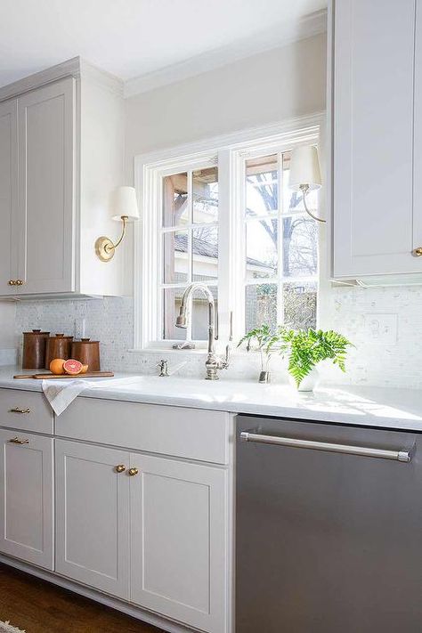 Light Grey Wood Floors, Kitchen Window Ideas, Kitchen Sconces, White Beveled Subway Tile, Sconces Kitchen, Black Interiors, Light Gray Cabinets, Kitchen Peninsula, Quartz Counter