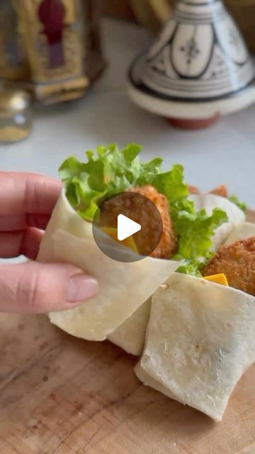 What to Cook, Bake, Eat & Drink 👨🏻‍🍳 on Instagram: "Mini Chicken Wraps

Ingredients:
🌯 Tortilla wraps
🍗 Crispy chicken or nuggets
🥗 Lettuce
🥪 Mayonnaise
🧀 Cheese slices

Preparation:

1.	Lay a tortilla on a work surface and cut it into 4 pieces.

2.	Place a layer of lettuce in the center of each tortilla piece.

3.	Add some pieces of crispy chicken or nuggets.

4.	Put a cheese slice on top.

5.	Add a dollop of mayonnaise.

6.	Roll the tortilla into a wrap.

Follow @hersavorybite for more cooking fun!

📹 @aminab120

#wrap #chickenwrap #miniwraps #appetizers #appetizersideas #chicken #partyfood #partyfoodideas" Tortilla Wraps, Chicken Wraps, Chicken Nuggets, Crispy Chicken, Work Surface, What To Cook, Lettuce, Mayonnaise, Party Food