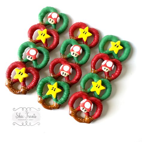 Super Mario Chocolate Covered Pretzels, Super Mario Bros Strawberries, Mario Themed Chocolate Strawberries, Mario Pretzel Rods, Mario Chocolate Covered Pretzels, Super Mario Pretzels, Super Mario Chocolate Covered Strawberries, Mario Pretzels, Super Mario Bros Treats