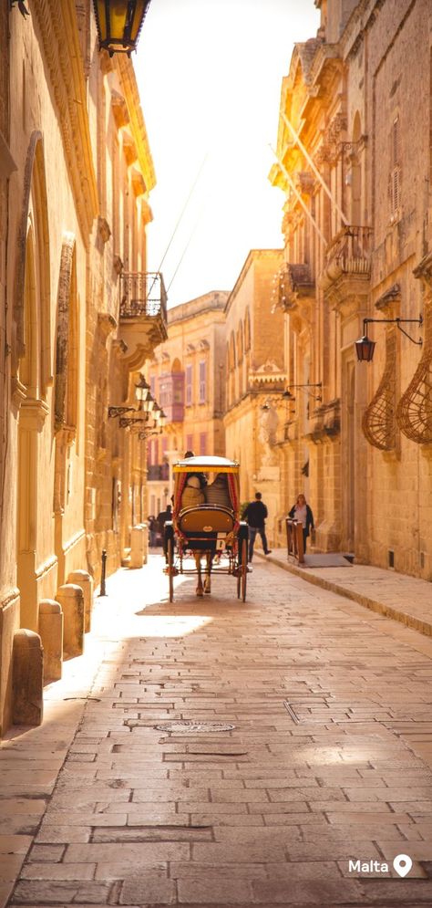 A horse-drawn buggy being pulled down a sunlit, narrow cobblestone street Malta Mdina, Mdina Malta, Malta Travel Guide, Malta Beaches, Malta Island, Malta Travel, Family Travel Destinations, Beautiful Sunrise, Travel Sites