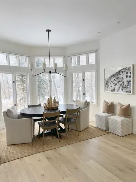 HOME \ dining nook space! Round black table that also turns into a larger oval. Upholstered end chairs paired with solid wood chairs. Loving this modern country farmhouse space for winter. | SBK Liivng Modern Farmhouse Circular Dining Table, Lakehouse Round Dining Table, Arhaus Kensington Round Dining Table With Chairs, Round Black Table, Dining Table Drum Pendant Oval, Round Dining Table 60”, Oval Dining Room Table, Big Comfy Chair, Dining Roo