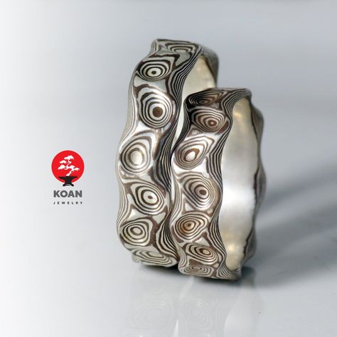 "These are mokume gane wedding rings made of sterling silver and traditional japanese alloy shakudo (copper 95%+gold 5%). The width of each is 5-6 mm. Koan mokume gane jewellery My name is Andrew Seginovich, designer, maker and creator of Koan Mokume gane Jewelry. Welcome to my shop! The studio was created in 2005, and since that time I've been seeking the most interesting, inspiring and beautiful designs to make you happy. I hope you will enjoy my work and I promise to do my best to make you sa Silver And Copper Jewelry, Wedding Rings Silver, Mokume Gane Ring, Jewelry Rings Unique, Y2k Rings, Edgy Jewelry, Mokume Gane, Mother Rings, Rings Silver