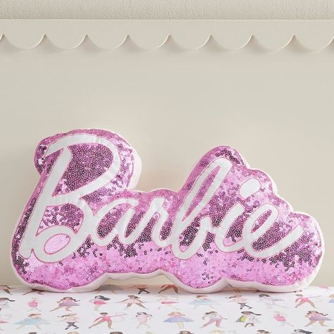 For a touch of shine to their space, add this plush Barbie(TM) pillow! With pink sequins and signature Barbie lettering, this shimmery piece adds fun flair to any chair or bed. DETAILS THAT MATTER Pillow is made from 100% cotton sateen. Cotton sateen is known for its luxurious sheen while providing supreme softness and ultra durability. Reverses to a 100% yarn-dyed cotton percale with a solid pattern. Yarn-dyed fiber has incredibly rich color that holds its vibrancy over time. Pillow is filled w Barbie Lettering, Barbie Bed, Barbie Room Decor, Hot Pink Room, Tm Logo, Barbie Bedroom, Barbie Room, Barbie Logo, Logo Shapes