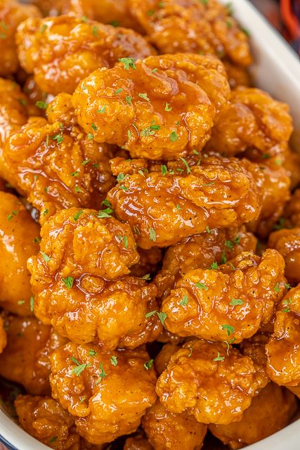 Sweet & Spicy Boneless Wings - great for parties or a quick lunch/dinner. Use frozen chicken bites and this comes together in no time!! Chicken tossed in hot sauce, brown sugar and butter. Seriously delicious!! Serve with fries and ranch or bleu cheese dressing. These are always the first thing to go at our football parties! #chicken #wings #tailgating #partyfood Spicy Boneless Wings, Boneless Wing Recipes, Boneless Chicken Wings, Football Friday, Wing Sauce Recipes, Crispy Chicken Recipes, Chicken Wing Sauces, Boneless Wings, Plain Chicken