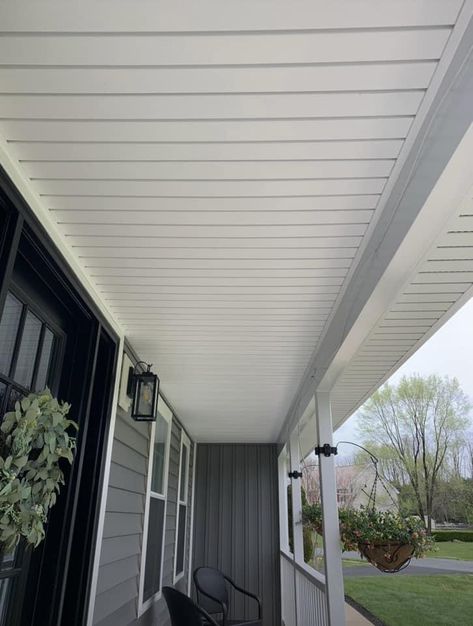 Use vinyl soffit for a budget friendly ceiling material. Black Soffit Under Porch, Soffit Porch Ceiling, Vinyl Soffit Ceiling Porches, Soffit Ideas Exterior, White Soffit Black Fascia, Dark Soffit And Facia, Exterior Molding, Soffit Ideas, Vinyl Soffit