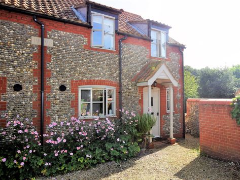 A charming flint cottage offering a family or friends the perfect holiday home, enjoying an enviable location in the village of Warham and located less than 2 miles from Wells-next-the-Sea. Flint Cottage, Wells Next The Sea, Norfolk House, Houghton Hall, Norfolk Coast, Wooden Gates, Farmhouse Exterior, Wood Burner, Beach Hut