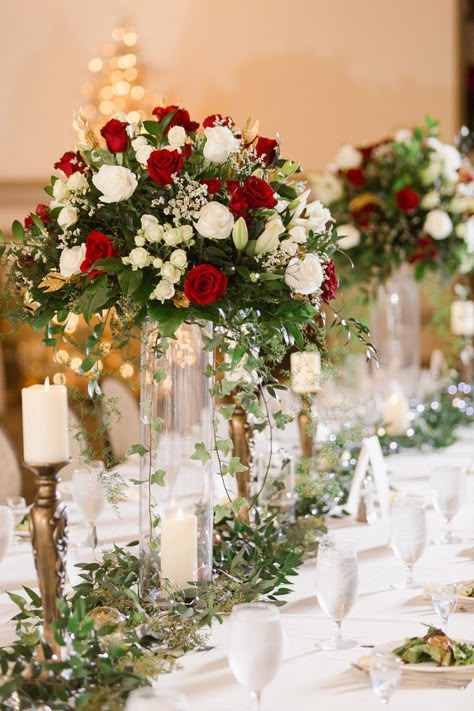 Rose Flower Arrangements Wedding, Red Winter Wedding Centerpieces, Y’all Centerpieces, Red Rose Wedding Reception Decor, Red White Green Wedding Decorations, Red Tall Centerpieces, Red Rose Centrepiece Wedding, Crimson And White Wedding, Classic Wedding Flower Arrangements