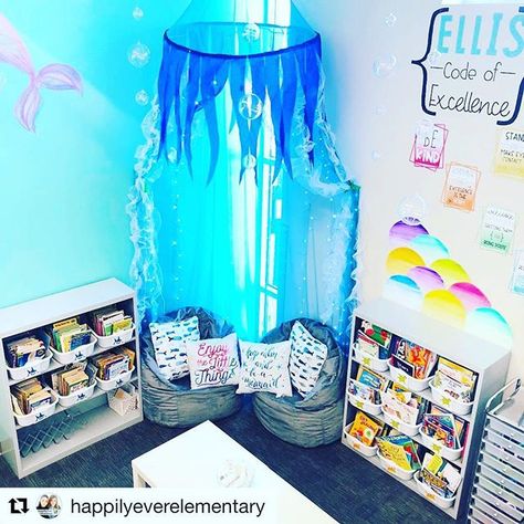 Still totally obsessed with @happilyeverelementary reading corner!!! Something big is coming to Mrs. Keenans room!! #staytuned #mermaid DIVING into a good book is easy when its in a MER-MAZING reading corner! Dont be JELLY! Im sorry for the puns... I cant help it. This canopy is from Oriental Trading. I cut some stuff off of it sewed some tulle on and added LED lights! Check out our IG story to see the magic in action! #teachers #iteachfirst #loveofteaching #iteachk #happilyeverelement Ocean Reading Corner, Mermaid Classroom, Ocean Classroom Theme, Turtle Classroom, Under The Sea Classroom, Beach Classroom, Reading Corner Classroom, Beach Theme Classroom, Ocean Theme Preschool