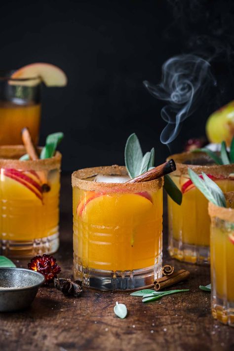 These apple cider margaritas are a seasonal twist on a classic cocktail recipe. Sweetened with maple syrup and garnished with a cinnamon sugar rim, these are perfect for Thanksgiving or another holiday gathering. Cinnamon Apple Cider Margarita, Simple Apple Cider Cocktail, Cinnamon Maple Whiskey Sour, Apple Cinnamon Bourbon Cocktail, Maple Bourbon Sour Cocktail, Apple Pie Cocktail, Cinnamon Sugar Rim, Apple Cider Mimosa, Unsweetened Cranberry Juice