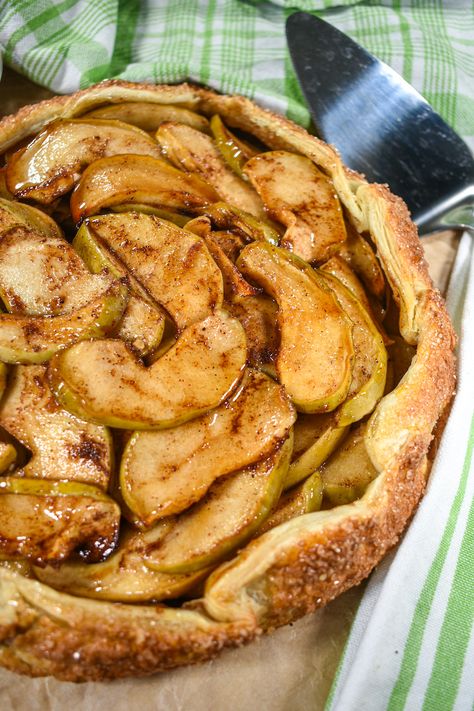 A rustic apple galette made with sliced Granny Smith apples, brown sugar, lemon, and spices. Serve this easy galette with puff pastry with a scoop of vanilla ice cream and a drizzle of homemade caramel sauce! Galette With Puff Pastry, Easy Apple Galette Recipe, Rustic Apple Galette, Apple Galette Recipe, Apple Galette, Galette Recipe, Homemade Caramel Sauce, Pie Tart, Apple Pear