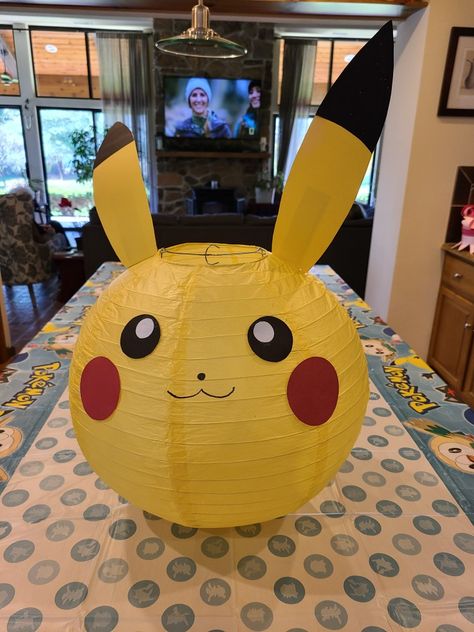 Pokemon Paper Lanterns, Pikachu Theme Party, Pikachu Birthday Party Ideas Diy, Pikachu Bday Party Ideas, Pikachu Centerpieces, Pikachu Girl Birthday Party, Pikachu Decorations Party Ideas, Pikachu Party Decorations, Pikachu Birthday Party Decorations