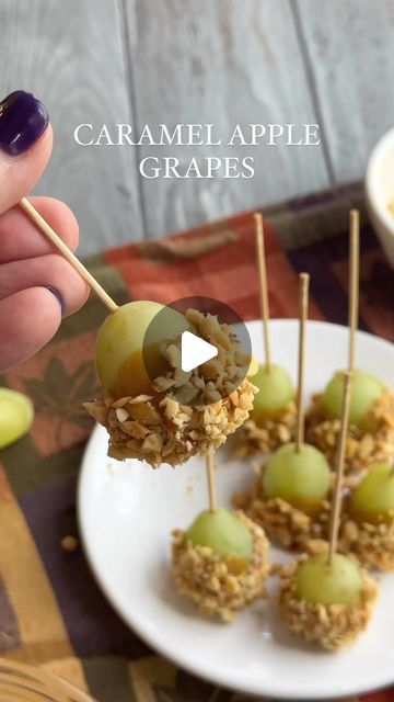 Cheese, Charcuterie, Fun Food Boards & MORE on Instagram: "•CARAMEL APPLE GRAPES•

Raise your hand if biting into a fullsize caramel apple is a little intimidating to you. 🙋🏼‍♀️🙋🏼‍♀️ I mean, how do you even do it?  Enter these mini caramel grape treats!  Basically the same concept, but much more manageable and just as tasty! 🙌🏻🍏🥜

INGREDIENTS:
green grapes 
store bought or homemade caramel sauce 
chopped peanuts
(long toothpicks for serving)

HOW TO:
1.  Wash green grapes and set aside to dry. 
2.  Give your caramel sauce a quick stir. Check out my previous post on how to make your own. (Store bought is def ok, too!)
3.  Stick the toothpick into the grape so that it can stand up on its own. 
4.  Dip the grape into the caramel sauce and coat about 2/3 of it.
5.  Roll the grape cover Grape Treats, Charcuterie On A Stick, Charcuterie Ideas, Food Boards, Buzzfeed Tasty, Homemade Caramel Sauce, Mini Bites, Bite Size Desserts, Raise Your Hand If