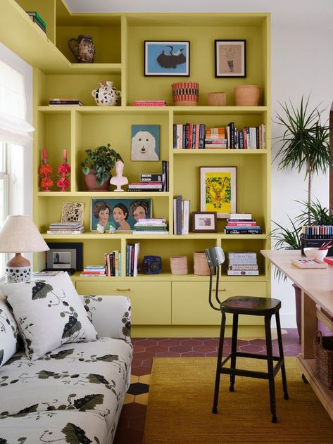 Display Corner Ideas, Funky Built In Shelves, Painted Wall Shelves, Coloured Bookshelves, Home Library Shelves, Bookshelf Eclectic, Weird Corner In Living Room, Sofa In Middle Of Living Room, Colored Bookshelf