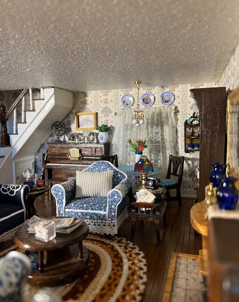 I finally finished the living room in the 1930s dollhouse. It was a little difficult trying to style it as there were not many examples of the types of items that would be in this age of house. And, of course, I made more work for myself by adding a piano and pipe table. I'm really happy about the way it turned out! #dollhouse #dollhouseminiatures #miniatures #minis #minismakemehappy #12thscale #1930sdollhouse #dollhousedecor #dollhousedecorating Southern Gothic Dollhouse, 1930s Dollhouse, Doll House Living Room, Work For Myself, Dollhouse Inspiration, Dollhouse Decorating, Dollhouse Living Room, Pipe Table, Miniature Things