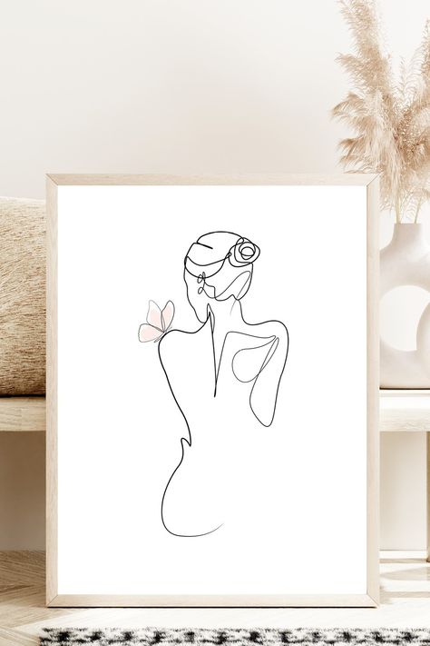 Elegant minimalist line art drawing of a woman undressing with a delicate pink butterfly on her shoulder. Set in a natural frame against soft, beautiful boho decor with subtle lighting. Woman Minimalist Drawing, Apartment Mural, Minimalist Line Art Woman, Butterfly Decorations Bedroom, Pink Line Art, Feminine Line Art, Line Drawing Woman, Butterfly Boho, Beauty Transformation