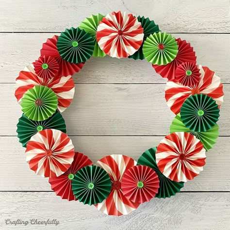 Wreath Out Of Paper, Christmas Rosettes Paper Crafts, Wrapping Paper Wreath, Rosette Christmas Tree, Christmas Wreath Paper Craft, Paper Rosettes Christmas, Paper Holly Wreath, Diy Paper Wreath Christmas, Paper Wreaths Ideas