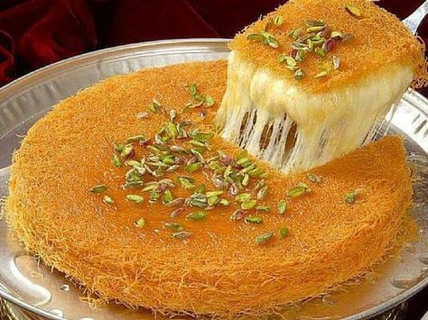 A Brief History Of Kunafa Kunafa is a well-known Arabic dessert. It is a syrup soaked cheese pastry. Some say it dates back to the Ottoman Empire, others say its origin is from Turkey, Palestine, Egypt, or Greece ( see the editor’s note below ). Well, whatever it’s true origin, it is a favorite of… Kunafa Recipe, Arabisk Mad, Istanbul Food, Arabic Sweets Recipes, Arabic Desserts, Arabic Dessert, Middle Eastern Desserts, Turkish Desserts, Sweet Dough