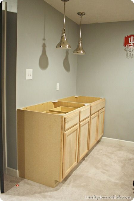 Expanding a small basement kitchenette, moving the sink, adding additional cabinets for more storage Installing Laminate Countertops, Basement Rental, Kitchenette Cabinets, Basement Update, Kitchenette Ideas, Space Under Stairs, Basement Finish, Basement Kitchenette, Basement Studio