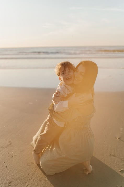 mom and son hugging during sunrise on the beach Mother Son Beach Photoshoot, Mom And Toddler Beach Photos, Mom And Son Beach Photo Ideas, Mother Son Beach Photos, Mom And Son Beach Pictures, Toddler Beach Photos, Mom And Son Photography, Mom And Baby Poses, Mommy Son Photoshoot