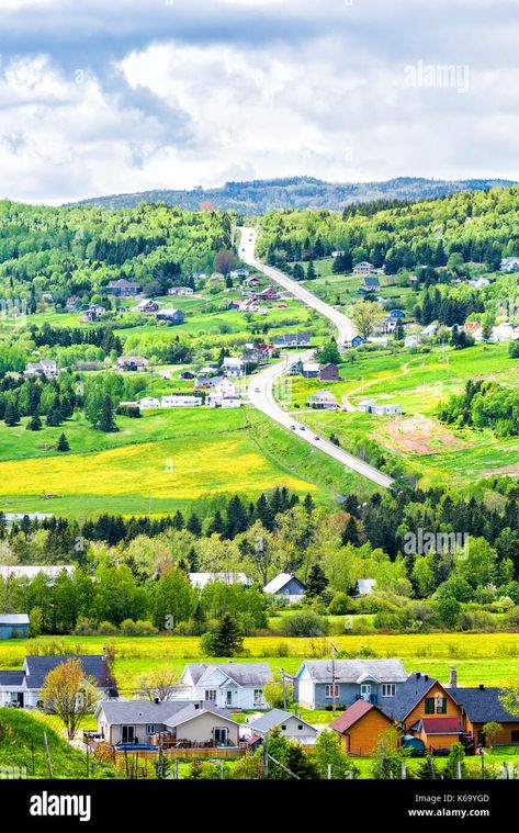 Les Eboulements, Charlevoix, Quebec, Canada cityscape or skyline with main highway steep curvy road going vertically up, patch farm green dandelion fi Charlevoix Quebec, Quebec Canada, Cityscape, Dandelion, Maine, Road, Green, Nature