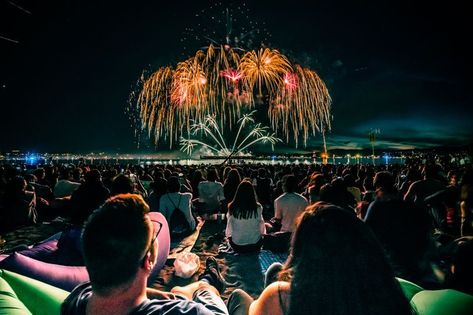 Picture of a large crowd of people watching an enormous fireworks display at night Firework Painting, Lights Festival, Fireworks Photography, Human Relations, Photo Sharing App, Large Crowd, Fireworks Show, Viewing Party, People Watching