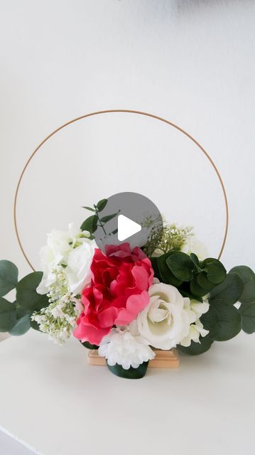 Party like Marie| Denver Florist & Event decoration on Instagram: "Wreath hoop centerpiece. Dollar tree diy #weddingcenterpiece #wreathcenterpiece #hoopwreath #wreathdecor #dollartreediy #dollartreecrafts #rustic" Graduation Hoop Centerpiece, How To Make Hoop Centerpiece, Floral Foam Ring Centerpiece, Dollar Tree Ring Centerpiece, Hoop Floral Centerpieces, Gold Ring Centerpiece Diy, Metal Ring Crafts Ideas, Dollar Tree Floral Centerpiece, Reusable Centerpieces Ideas