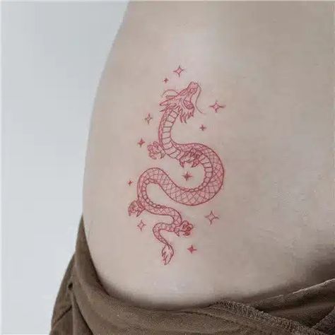 Minimalist Chinese Dragon Tattoo Red Dragon Tattoo Minimalist, Simple Red Dragon Tattoo, Red Dragon Small Tattoo, Tiny Dragon Tattoo Chinese, Tattoo Idea Dragon, Red Colored Tattoos, Dragon Tattoo Symbolism, Simple Small Dragon Tattoo, Single Needle Dragon Tattoo