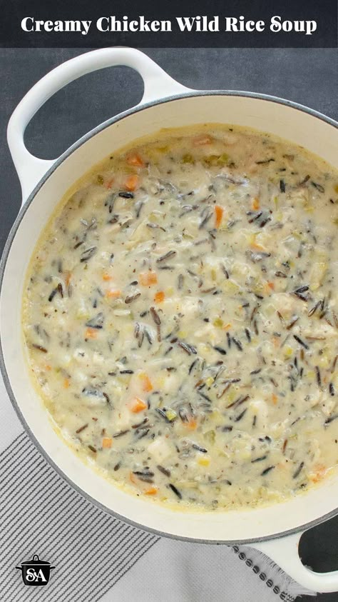 Creamy Chicken Wild Rice Soup is the ultimate comfort food soup! Packed with tender chicken, hearty wild rice, and loads of aromatic veggies in a rich, creamy broth, it's the perfect cozy meal for chilly days. Get the recipe now and warm up from the inside out! Get the recipe at SoupAddict.com. Cream Of Chicken With Wild Rice Soup, Cream Wild Rice Soup, Rice A Roni Wild Rice Soup, Chicken Bacon Wild Rice Soup, Crockpot Creamy Chicken Wild Rice Soup, Chicken Wild Rice Soup Creamy, Cream Chicken Wild Rice Soup, Creamy Wild Rice Soup With Rotisserie Chicken, Wild Rice Chicken Soup Stove Top