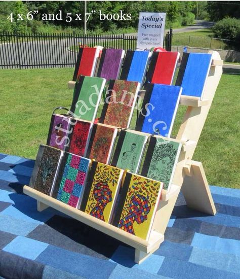 Portable book display stand from http://stuadams.ca Book Stands Display, Portable Art Display, Craft Fair Book Display, Display For Greeting Cards, Vendor Book Display, Tabletop Book Display, Book Display For Craft Show, Journal Display Craft Show, Collapsible Display Stand