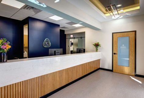 Check out this Dental Specialty Clinic Buildout! Glass sliding doors with calming accent waves for patient privacy are found on both the Oral Surgery & Endodontic sides of the clinic. This dental practice also features private doctors’ offices, a private restroom with shower, and a large staff lounge. The cream, gold, and black color palette that brings a fresh, bright vibe throughout, all the way to the building’s exterior. Cosmetic Injections, Apex Design, Staff Lounge, Dental Office Design Interiors, Medical Office Design, Reception Desk Design, Black Color Palette, Office Renovation, Dental Office Design