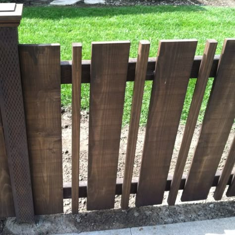 Now here's an idea I can use.  My pickets are too far apart and I was considering stapling netting to the back to prevent Django from just walking through the spaces.  But this might be just as inexpensive, and I like the look! Pagar Modern, Fencing Design, Brick Fence, Front Fence, Pallet Fence, Yard Fence, Fencing Ideas, Front Yard Fence, Diy Fence