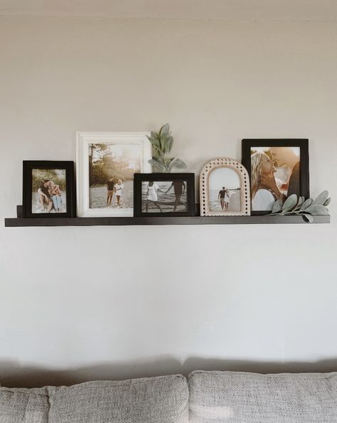 Black Picture Shelf Living Room, Decor Above Couch Living Room, Floating Shelf Above Couch, Pictures Above Couch, Shelf Above Couch, Decor Above Couch, Shelves Above Couch, Fireplace Room, Photo Table