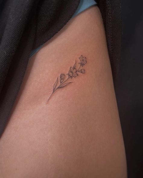 Minimalist Floral Hip Tattoo, Tattoo Ideas Jasmine Flower, Hidden Flower Tattoos, Come Flower Tattoo, Lokelani Flower Tattoo, Classy Rose Tattoo, Torso Flower Tattoo, Small Lily Flower Tattoo Simple, Dainty Fine Line Flower Tattoos