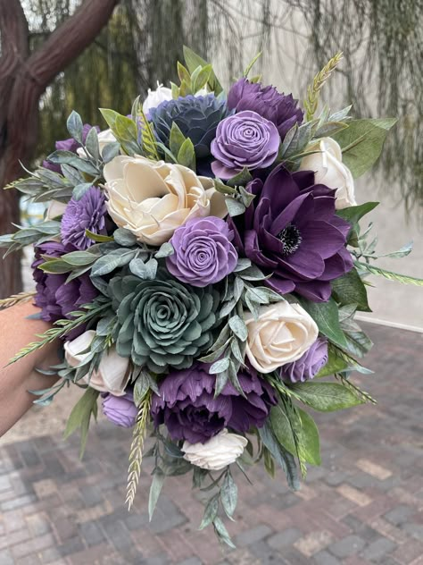 Katie 3/25/23 - Wood Flower Custom Wedding Quote in Shades of Purple, Sage Colors, Succulent center, White Anemones and Plum Purple Peonies, Dusty Miller Greenery, (1) Bride 11x14" Cascade Bouquet $329 (1) Groom Boutonniere $FREE (6) Matching 10" Bridesmaids $1,170.00 ($199 ea/discounted to $195 ea.) (6) Matching Boutonnieres $192 (33.99-38.99 ea/discounted to $32 ea.) (1) Consultation/Quote prep $ FREE TOTAL PACKAGE PRICE ~ $1,691.00 *FREE Standard Shipping (Unless Specialty or Expedited) *Your Plum And Hunter Green Wedding, Dark Green And Purple Wedding, Purple Dahlia Bouquet, Purple And Green Wedding Cake, Shades Of Purple Wedding, Purple Bride Bouquet, 10 Bridesmaids, Rustic Purple Wedding, Purple Black Wedding