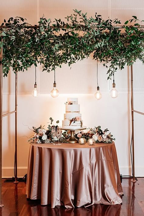 The cake and dessert display was framed by the copper arbor at this opper-toned Fall Wedding at Upper Shirley Vineyards - *Paisley & Jade - Vintage & Specialty Rentals in Virginia, Washington, DC and North Carolina. Image by Alex Tenser Photography. Wedding Cake Backdrop, Cake Table Backdrop, Wedding Cake Table Decorations, Cake Backdrops, Wedding Cake Display, Floral Installation, Tafel Decor, Cake Table Decorations, Wedding Cake Table