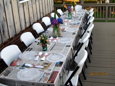 Table with newspaper and skirting. Newspaper Table Decor, Funny Homeless Signs, Homeless Signs, Mason Jars With Flowers, Jars With Flowers, Formal Ideas, Mason Jar Flowers, Book Table, Booth Display